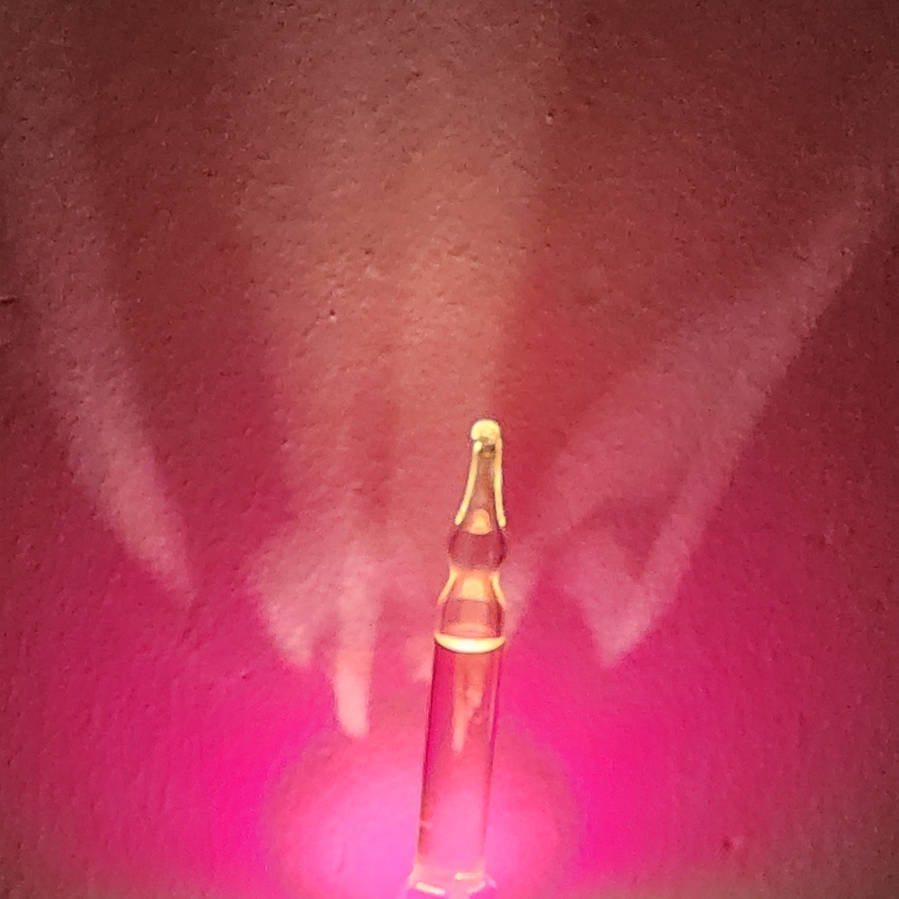 Glass Vial with Orange Glow